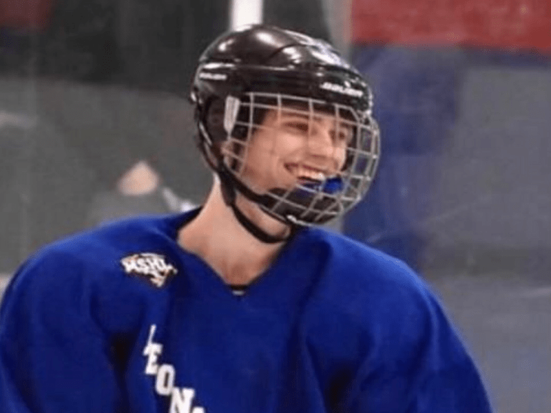 teenage boy in hockey uniform